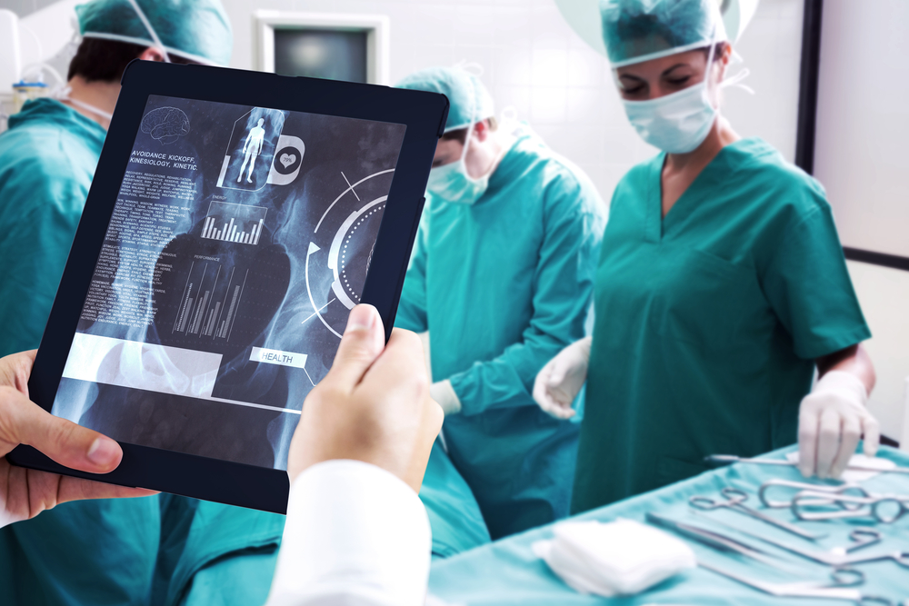 Man using tablet pc against medical interface on xray-3